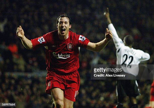 Robbie Fowler of Liverpool turns to celebrate his goal which was disallowed as Chris Powell of Charlton Athletic signals the offside during the...