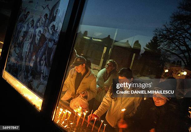 Romanian christian orthodox believers light candles at the St. Parascheva Metropolitan Cathedral in Iasi city, 420 km northeast from Bucharest, 03...