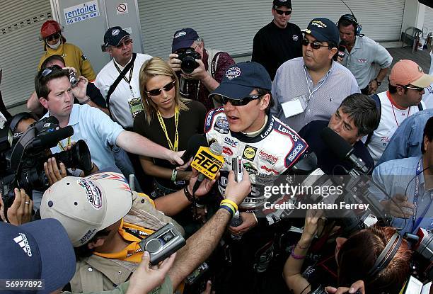 Adrian Fernandez driver of the Lowe's Chevrolet speaks to the media during qualifying for the NASCAR Busch Series Telcel-Motorola 200 on March 3,...