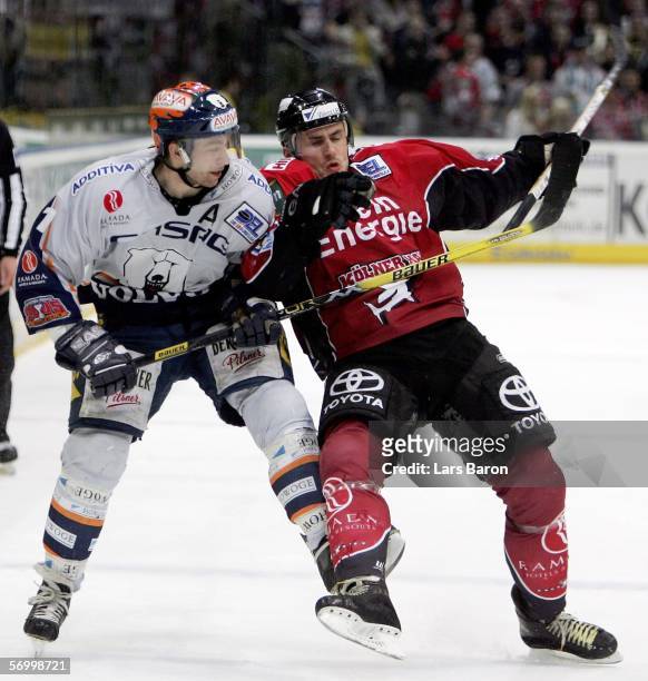 Sven Felski of Berlin is seen in action with Ivan Ciernik of Cologne during the DEL Bundesliga match between Cologne Haie and Eisbaeren Berlin at the...