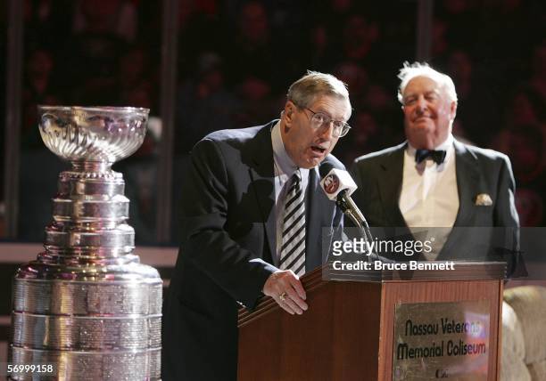 Former coach Al Arbour addresses the crowd as former GM Bill Torrey looks on during a ceremony honoring the 25th anniversary of the New York...