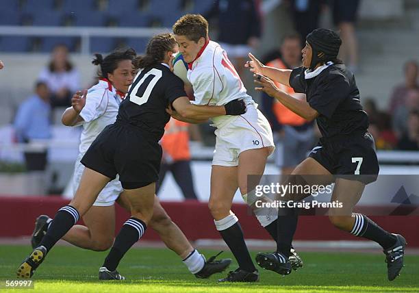 Shelley Rae of England is tackled by Anna Richards of New Zealand during the IRB Women's World Cup Final match between England and New Zealand at the...