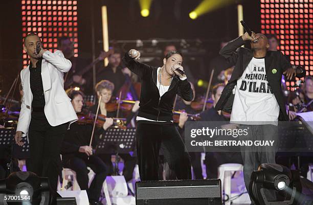 French singer Disiz La Peste performs with Diams and Soprano after winning the best hip-hop album of the year award during the 21st "Victoires de la...