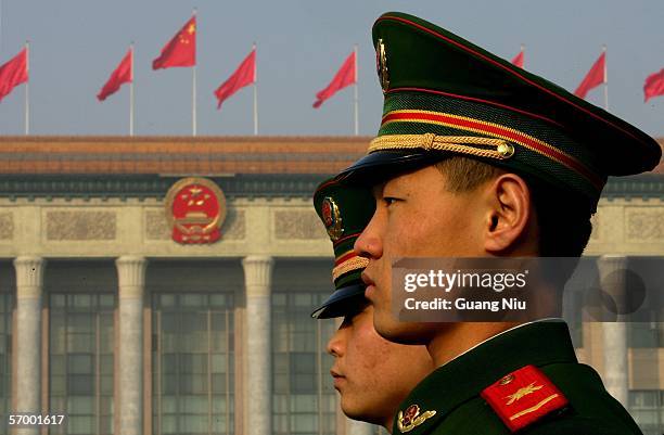 Chinese policemen guard in front of the Great Hall of the People during the opening ceremony of the National People's Congress , China's parliament,...