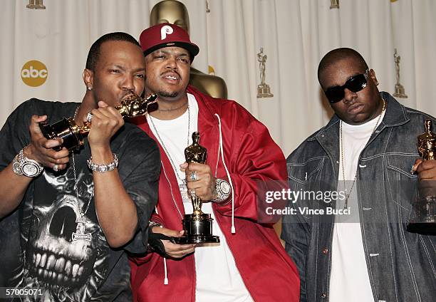 Juicy J, DJ Paul and Project Pat of "36 Mafia" pose backstage with their Oscar statuettes for Best Achievement in Music Written for Motion Pictures...