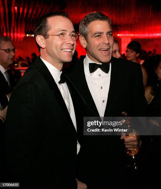 Producer Michael Costigan and actor George Clooney pose as they attend the Governor's Ball after the 78th Annual Academy Awards at The Highlands on...