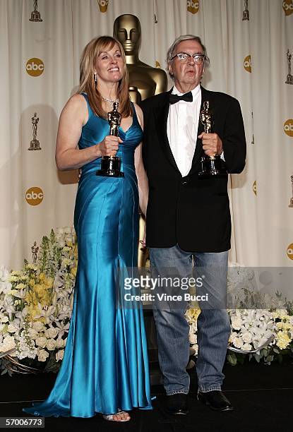 Writer/producer Diana Ossana and writer Larry McMurtry pose backstage with their Oscar statuettes for Best Writing, Screenplay Based on Material...