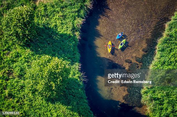 aerial of kayakers in a river - kayak stock pictures, royalty-free photos & images
