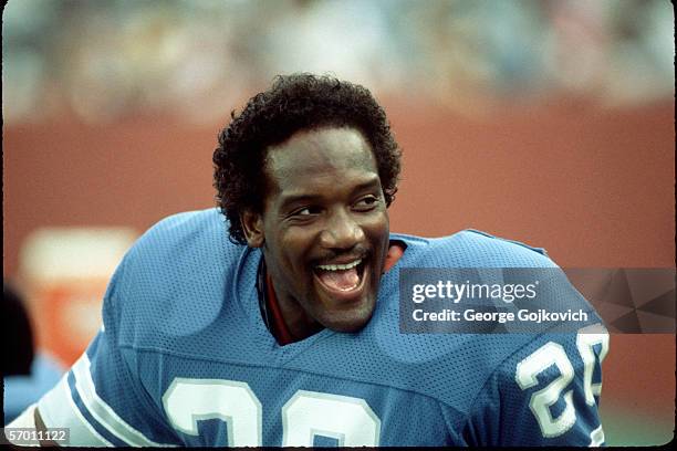 Running back Billy Sims of the Detroit Lions smiles while on the bench during a preseason game against the Buffalo Bills at Rich Stadium on August...