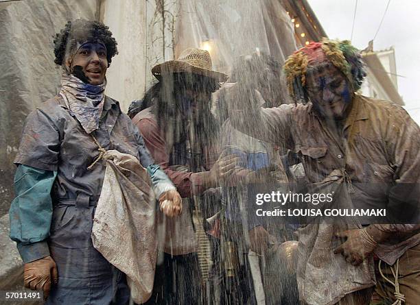 Participants of the colourful flour-war throw coloured flour and fumo on each other during the celebrations of the Clean Monday, which marks the end...