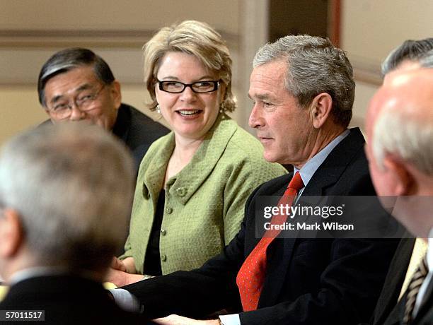 President George W. Bush is flanked by Transportation Secretary Norman Mineta and Education Secretary Margaret Spellings during a meeting with the...