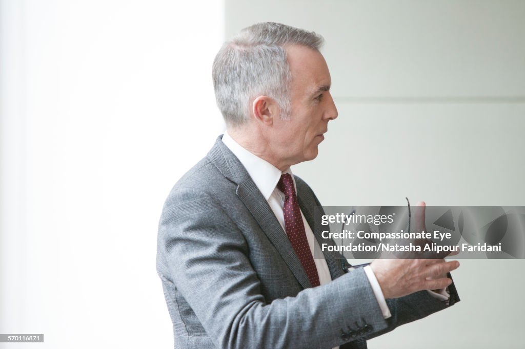 Businessman talking in meeting in conference room