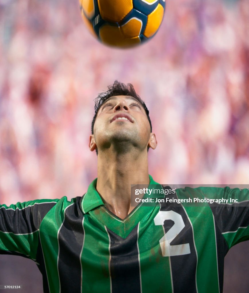 Soccer player heading the ball