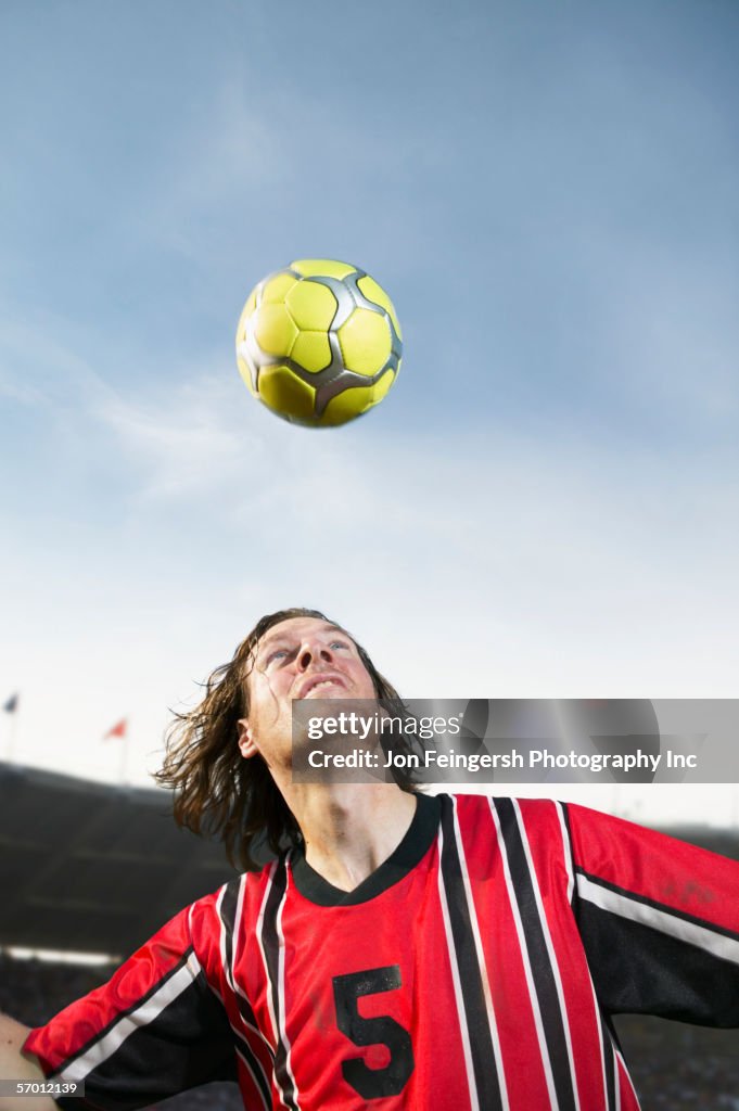 Soccer player heading the ball