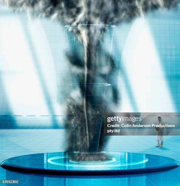 male scientist examining man made tornado - meteorologist stock pictures, royalty-free photos & images