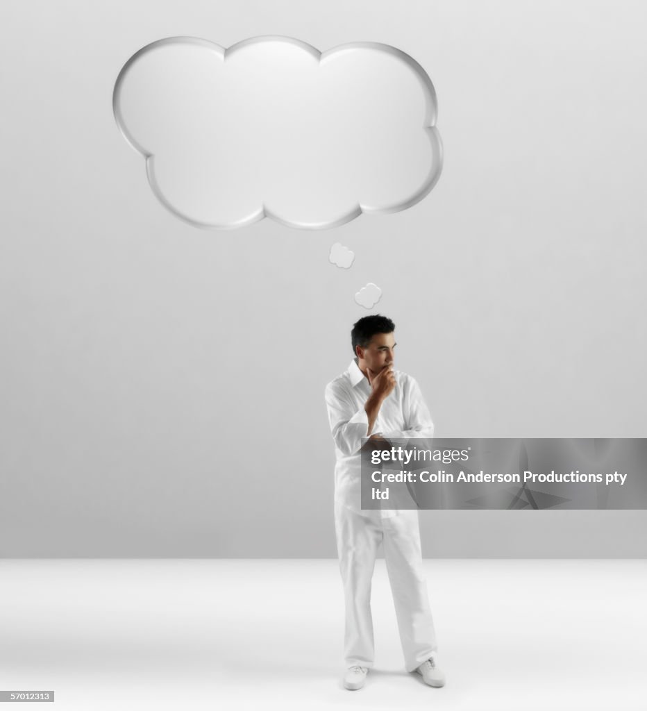 Young man with empty thought balloon over his head