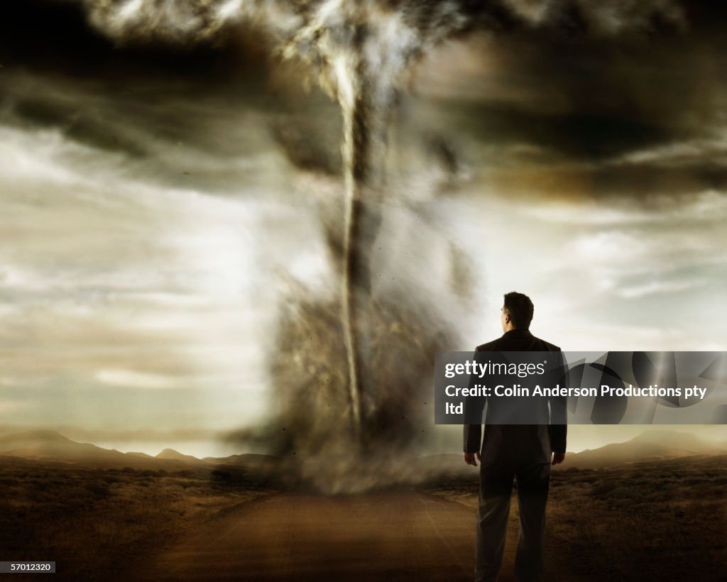 Businessman watching a tornado