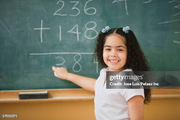 student doing mathematics on the chalkboard - child writing on chalkboard stock pictures, royalty-free photos & images