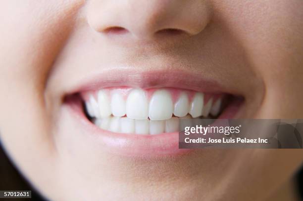 close up of young woman's smile - toothy smile stock-fotos und bilder