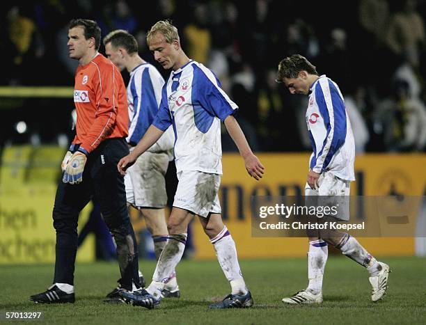 Goalkeeper Mathias Schober, Tim Sebastian and Marcel Schied of Rostock leave the ground disappoiunted after loosing 2-3 the 2. Bundesliga match...