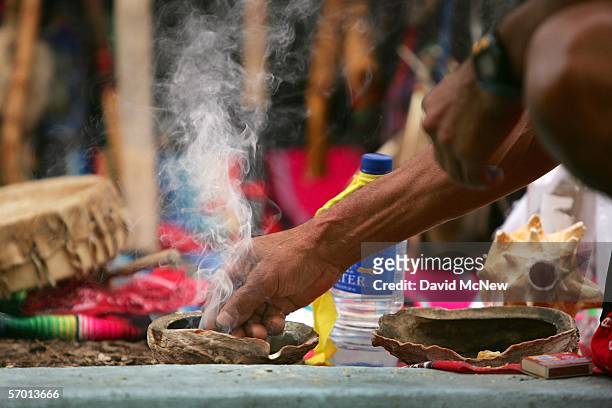 Smoke rises from an abalone shell containing burning copal that is traditionally used in Native American cleansing ceremonies and now is used by day...