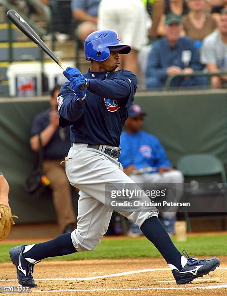 Outfielder Juan Pierre of the Chicago Cubs bats against the Oakland Athletics during a Spring Training game on March 6, 2006 at the Phoenix Municipal...