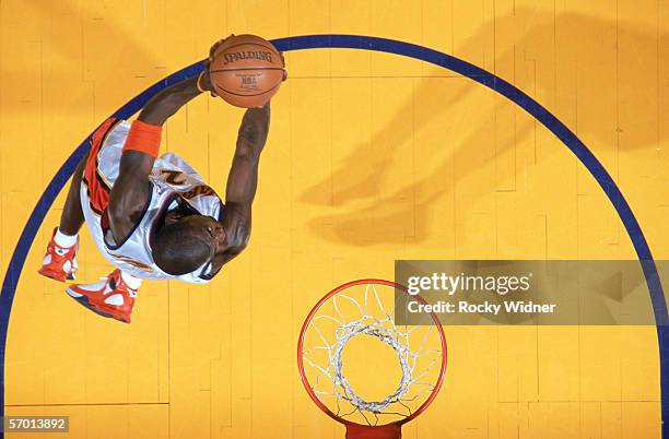 Jason Richardson of the Golden State Warriors takes the ball to the rim against the Denver Nuggets at The Arena in Oakland on February 6, 2006 in...