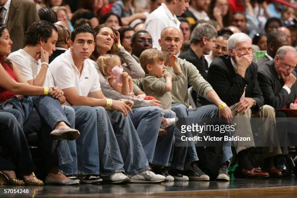 Steffi Graf and Andre Agassi watch the Miami Heat play the Sacramento Kings on January 22, 2006 at American Airlines Arena in Miami, Florida. The...