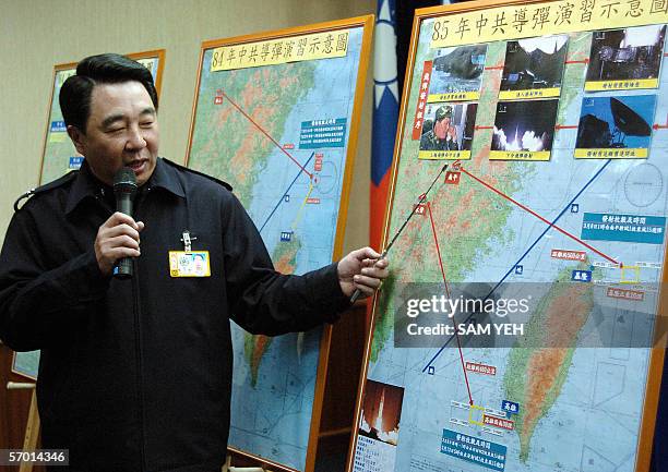 Taiwan's defense ministry spokesman Liou Chih-jein during a press conference at Taipei 07 March 2006, shows a map across the Strait as the ministry...