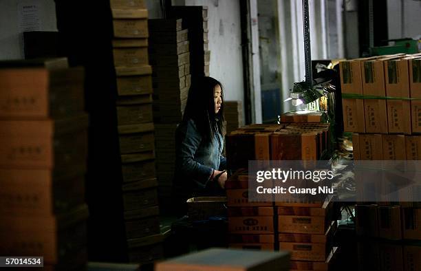 Chinese labourer works at a leather shoe workshop on March 4, 2006 in Wenzhou of Zhejiang Province, China. Wenzhou is one of the major shoe...