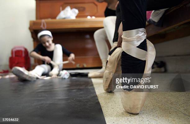 Iraqi ballerinas prepare for a ballet class at the Iraqi school of Music and Ballet, in downtown Baghdad, 05 March, 2006. Budding artists at...
