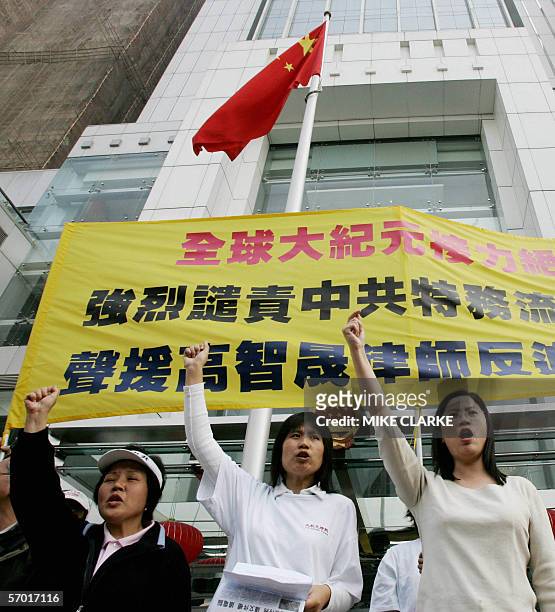 Members of The Epoch Times, a Falungong-linked newspaper, hold a protest outside the Beijing's representative office in Hong Kong, 10 February 2006....