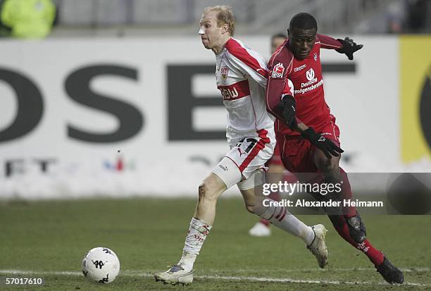 Boubacar Sanogo of Kaiserslautern competes with Ludovic Magnin of Stuttgart during the Bundesliga match between 1.FC Kaiserslautern and VFB Stuttgart...