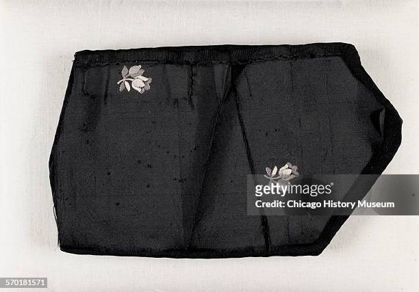 Fragment of black taffeta from gown worn by Mary Todd Lincoln at Ford's Theater on the evening of Abraham Lincoln's assassination, Washington DC,...