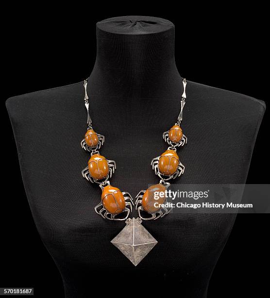 Necklace of sterling silver and carved amber titled Homage to Egypt, designed by Robert R Macklow, Chicago, Illinois, 1970.