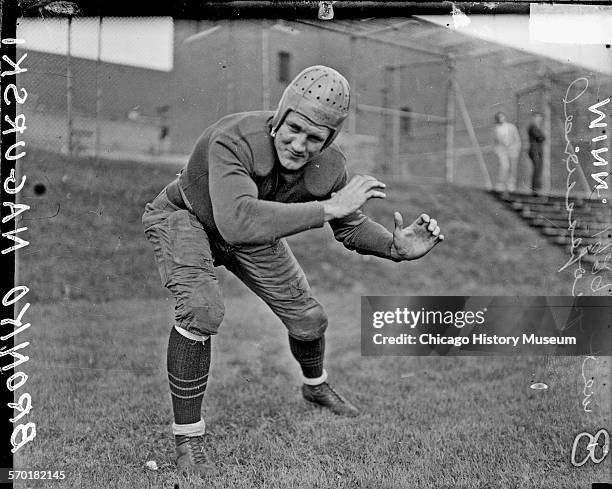 University of Minnesota football Bronko Nagurski crouching on an athletic field in or near Chicago, Illinois or Minneapolis-St Paul, Minnesota,...