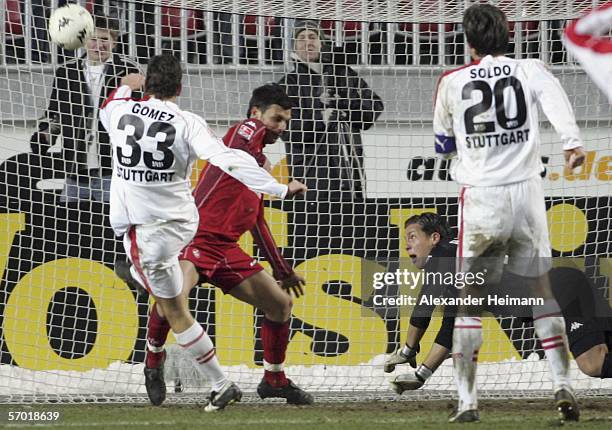 Mario Gomez of Stuttgart scores 1:1 in the the last minute of the match, while Matthieu Breda and goalkeeper Florian Fromlowitz of Kaiserslautern...