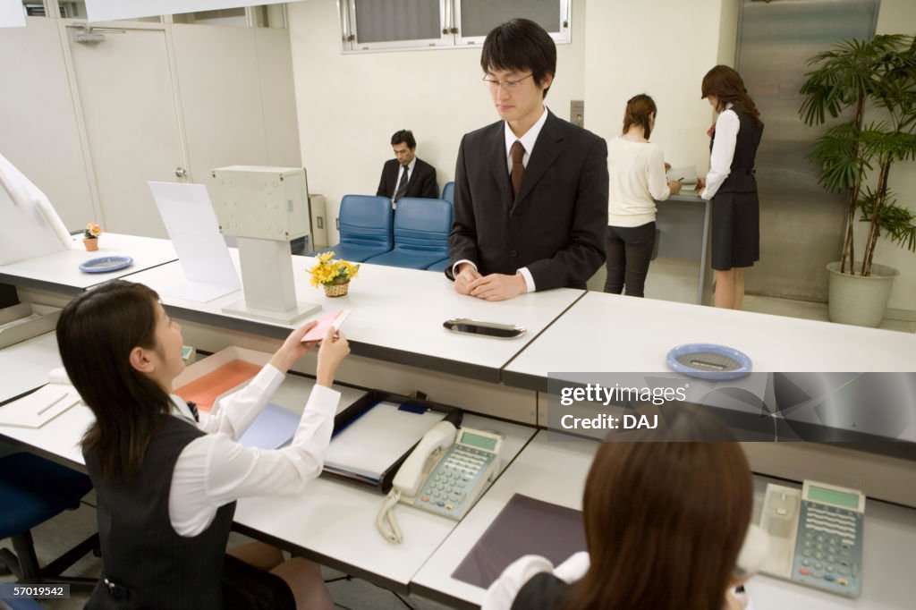 Counter In The Bank Bank Counter With Teller And Customer High-Res Stock Photo - Getty Images