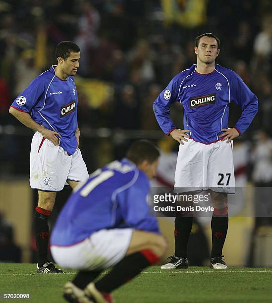 Kris Boyd of Rangers looks dejected alongside teammates after being knocked out of a UEFA Champions League match between Villarreal and Glasgow...