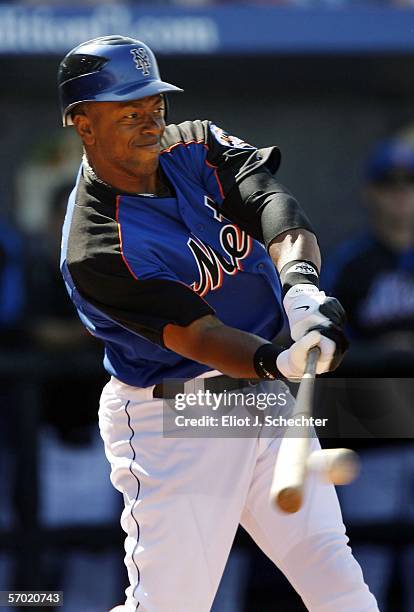 First baseman Julio Franco of the New York Mets connects for a base hit against the Houston Astros during a spring training exhibition game on March...