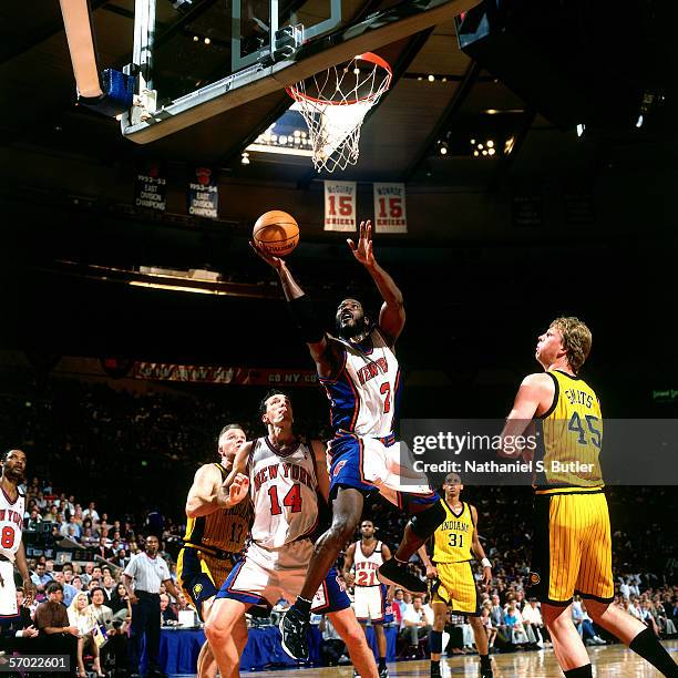 Larry Johnson of the New York Knicks drives to the basket for a layup against the Indiana Pacers during a 1999 NBA game at Madison Square Garden in...