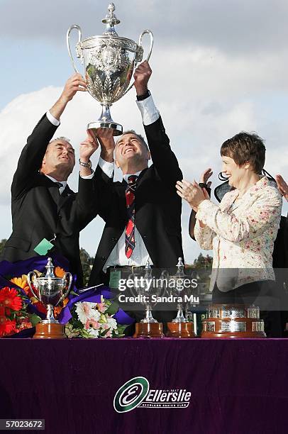 Pentane's owners Michael and Peter Fraher lift the SkyCity Auckland Cup as New Zealand Prime Minister Helen Clark applauds after Petane's victory in...