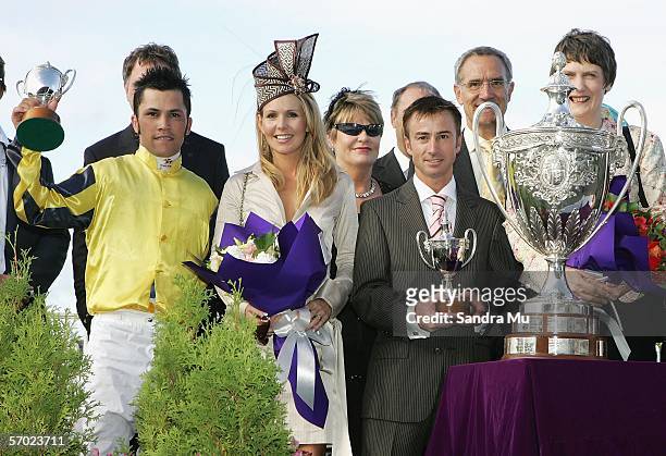 Jockey Michael Walker , Bridgette O'Sullivan and Trainer Lance O'Sullivan stand with the Auckland Cup after Pentane's victory in the SkyCity Auckland...