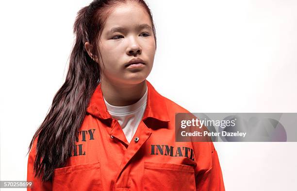 portrait of teen in prison - girls jumpsuit stock pictures, royalty-free photos & images