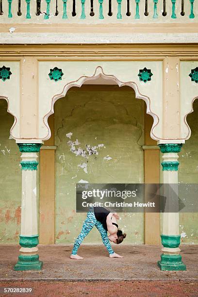 woman doing yoga in india. - mysore stock pictures, royalty-free photos & images