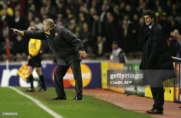 United Kingdom: Arsenal's coach Arsene Wenger directs his team as Real Madrid's coach Juan Ramon Lopez Caro looks on during a Champions League...