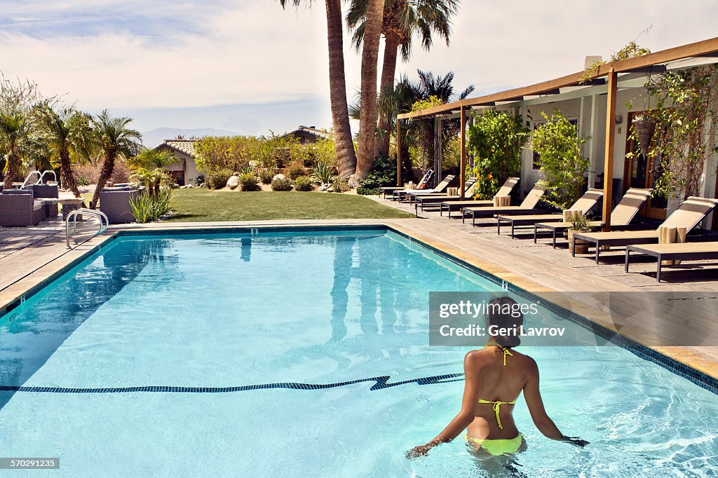 Woman in a swimming pool at a spa resort