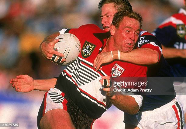 Greg Florimo of the Bears is tackled during a NRL match between the North Sydney Bears and the Sydney City Roosters held at North Sydney Oval May 24,...