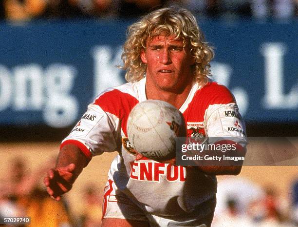 Nathan Brown of the Dragons passes the ball during a Australian Rugby League match held in Sydney, Australia. Brown's playing record - 171 First...