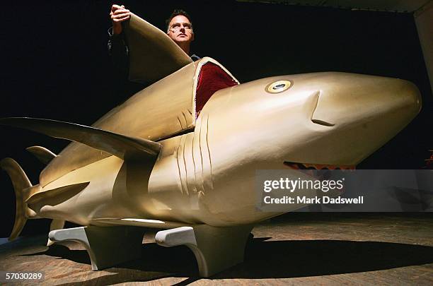 Donald Williams, Cultural Producer at Exhibitions for Festival Melbourne 2006, studies a Fantasy Coffin in the shape of a shark at 45 Downstairs...